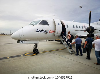 Melbourne, Australia: March 2019: Rex Regional Is A Small Airline Providing Transportation To Small Regional Town Including Melbourne To Burnie. Passengers Board For Their Flight.