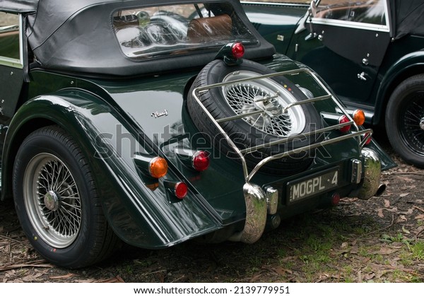 Melbourne, Australia - March 23, 2022:  Elegant\
black Morgan Plus car.  The Morgan Motor Company is a historic\
British car manufacturer that produces hand crafted retro sports\
cars from the past.