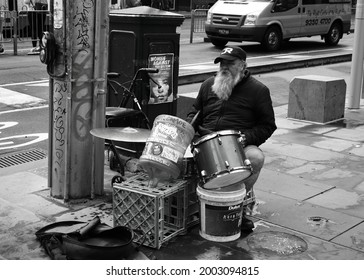 Melbourne, Australia - March 6, 2020: Old Bearded Man Playing Drums On The Street Of Melbourne