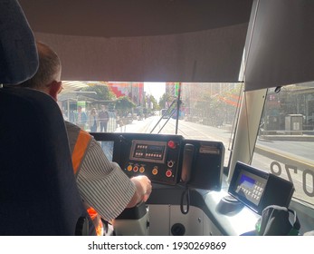 Melbourne, Australia - March 6th 2021:A Tram Driver Driving A Tram In Melbourne CBD On A Sunny Day