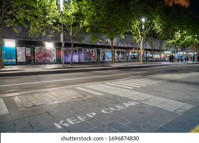 Melbourne, Australia - March 9 2020; Tram Stop On St. Kilda Road In Downtown Area Of City With Shelter And Billboards In Background.