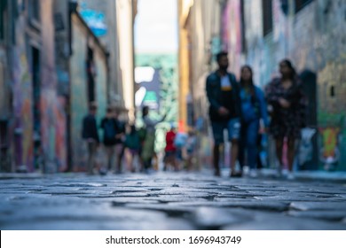 Melbourne, Australia - March 9 2020; Background abstract street scene of people walking towards taken Hosier Lane