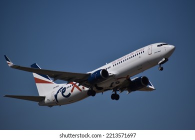 MELBOURNE, AUSTRALIA - May 13, 2022: A Rex Airlines Plane In The Cloudless Sky