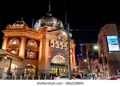 Melbourne, Australia - May 17, 2019: Lit Up Night View Of The Iconic Flinders Street Station. View From Swanston Street. Busy Night Life In The Surrounding Areas.