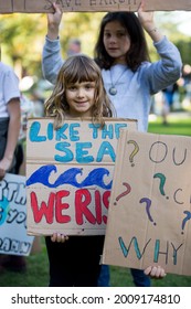 MELBOURNE, AUSTRALIA - May 21, 2021: Passionate Kids With Their Parents At Peaceful School Student Climate Change Protest In Melbourne  Happy Family 