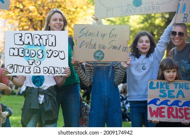 MELBOURNE, AUSTRALIA - May 21, 2021: Passionate Young Kids With Their Parents At Peaceful School Student Climate Change Protest In Melbourne  Happy Family 