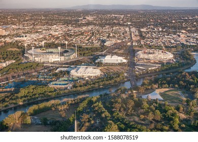 Melbourne, Australia - November 17, 2009: Aerial View On Several Sports Venues And Facilities Of Olympic Park Along Yarra River And Set In Wider Area Showing Suburbs And Mountains On Horizon.