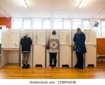 Melbourne, Australia - November 19, 2018: Voters participating in the 2018 Victorian state election at Antonio Park Primary School in Mitcham.