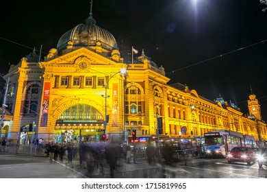 Melbourne, Australia - October 17,2013   People Crossing In Front Of Flinders Street Railway Station Melbourne  Australia Night Photography 