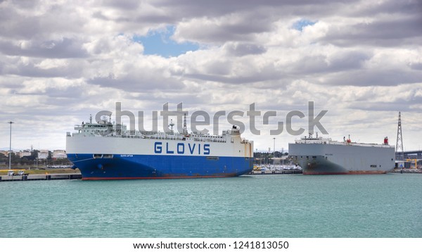 Melbourne,\
Australia - October 27: Car carrier ships in port of Melbourne on\
October 27, 2018 in Melbourne,\
Australia.