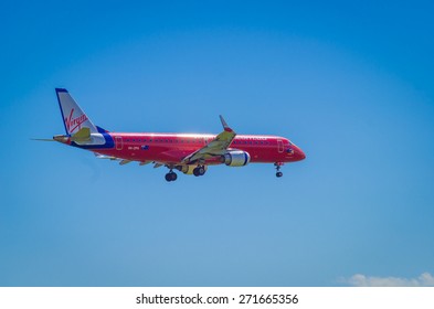 MELBOURNE, AUSTRALIA - October 5, 2013: Virgin Australia Embraer ERJ-190AR Jetliner On Approach To Melbourne's Tullamarine Airport.  Virgin Australia Is Australia's Second Biggest Airline.