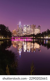 The Melbourne CBD skyline reflection over the Yarra River in front of a purple sunset 