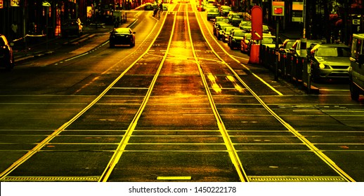 Melbourne City Tram Tracks Are Glowing With Golden Afternoon Sunlight Captured Through A Vintage Camera Lens