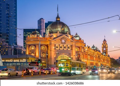 Melbourne Flinders Street Train Station with moving tram in Australia at sunset - Powered by Shutterstock