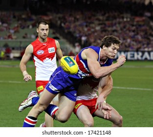 MELBOURNE - SEPTEMBER 12: Will Minson Is Tackled In The AFL Second Semi Final - Western Bulldogs Vs Sydney Swans, September 2008