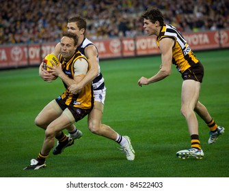 MELBOURNE - SEPTEMBER 9 : Brad Sewell (L) Is Tackled During Geelong's Win Over Hawthorn - September 9, 2011 In Melbourne, Australia.