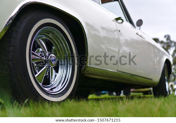 Melbourne, VIC / Australia - Sep 15 2019: Vintage\
car wheel in shiny chrome\
color