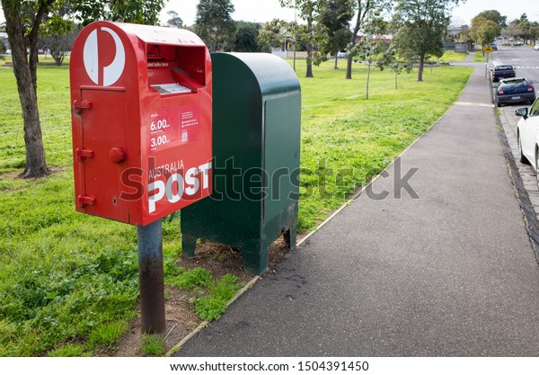 Melbourne, VIC/Australia-Sept 4th 2019: \
a red post box of Australia Post on suburban\
street.