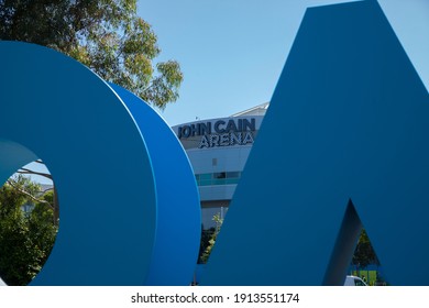 Melbourne, Victoria, Australia - 02.10.2021: John Cain Arena Seen Through Blue Australian Open Branding Blocks At Melbourne Park During The Australian Open Tennis Grand Slam.