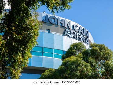 Melbourne, Victoria, Australia - 02.10.2021: The Top Of John Cain Arena Seen Through Eucalyptus Trees At The Australian Open Grand Slam Tennis Tournament At Melbourne Park On A Sunny Summer Morning.