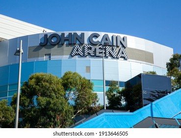 Melbourne, Victoria, Australia - 02.10.2021: The Top Of John Cain Arena Seen Through Eucalyptus Trees At The Australian Open Grand Slam Tennis Tournament At Melbourne Park On A Sunny Summer Morning.