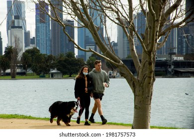 Melbourne, Victoria, Australia, 29 May 2021; People Walk And Exercise Around Albert Park Lake Wearing Covid 19 Masks With City Skyline In The Background During Victoria's Fourth Covid19 Snap Lockdown