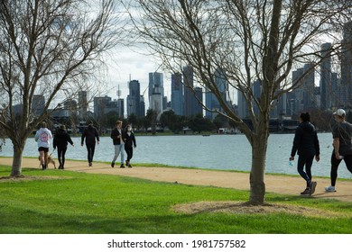 Melbourne, Victoria, Australia, 29 May 2021; People Walk And Exercise Around Albert Park Lake Wearing Covid 19 Masks With City Skyline In The Background During Victoria's Fourth Covid19 Snap Lockdown