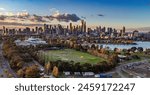 Melbourne, Victoria, Australia - Aerial view of Albert Park lake, golf driving range and Melbourne city skyline at sunset.