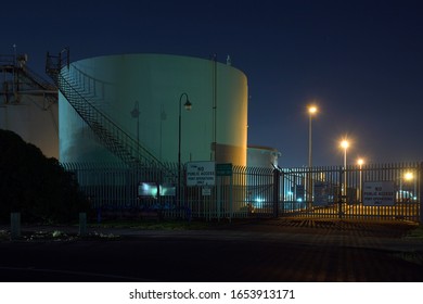 Melbourne, Victoria / Australia - Apr 13 2017:  Night image of an oil terminal tank farm at Breakwater Pier, Williamstown, Melbourne.
