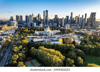 Melbourne, Victoria, Australia - April 14, 2024: Melbourne city skyline and Carlton Gardens with the Melbourne Museum and Royal Exhibition Building in the foreground.    - Powered by Shutterstock