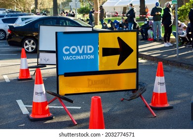 Melbourne, Victoria, Australia, August 30 2021: Covid Vaccination Sign. Queues Of People Waiting To Get Coronavirus Vaccine Outside Peanut Farm St Kilda Walk-in Covid-19 Vaccination Clinic. 