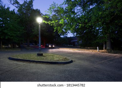 Melbourne, Victoria / Australia - Dec 28 2012:  Night Image Of A Quiet Suburban Street Corner And Roundabout At Twilight In The Leafy South Eastern Suburb Of Camberwell, Melbourne, Australia.