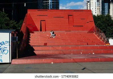 Melbourne, Victoria, Australia - July 8 2020: 2 Teens Kiss Each Other On What Would Usually Be A Busy Public Space On The Walkway Beside The Yarra River. This Is The Day Before The Second Lockdown.