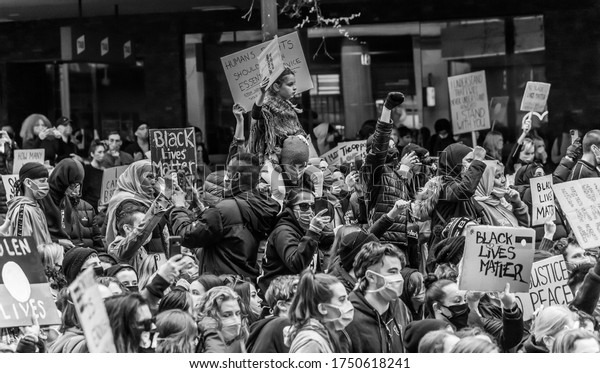 Melbourne, Victoria, Australia, June 6th, 2020:\
People have gathered carrying placards to a Black Lives Matter\
street protest