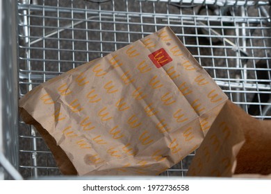 Melbourne, Victoria, Australia - May 13 2021: Mcdonald's Brown Paper Bag In A Trolley