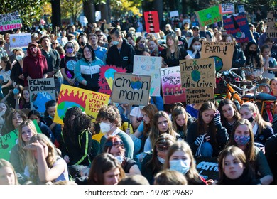 Melbourne, Victoria, Australia, May 21 2021: Large Crowd Of Student Protesters At Climate Change Rally. Children Holding Environmental Banners, Global Warming Signs Wearing Covid19 Masks.