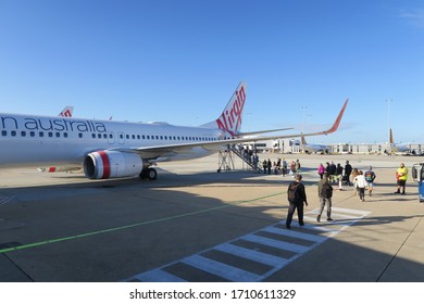 Melbourne, Victoria/Australia - June 30, 2019: Virgin Australia Before Departure From Melbourne To Hobart, Tasmania. Passengers Are Waiting In Line To To Get Onboard.