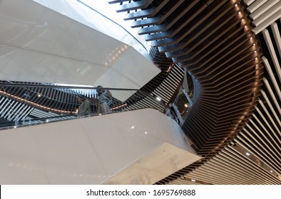 Melbourne, Victoria/Australia-March 9 2020: People ride the escalator in the architecturally modern  Emporium Mall in the city.