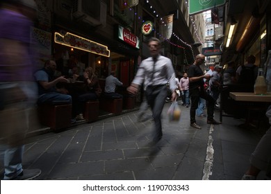 MELBOURNE,VICTORIA, AUSTRALIA, NOVEMBER 2017; People rush through a lane way in Melbourne’s CBD at lunch time. The city’s laneways are famous for their hip bars and restaurants.