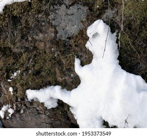 Melding snow on a rock
