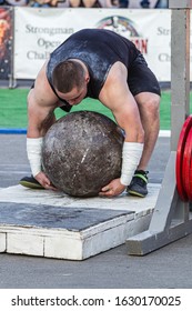 Melitopol, Ukraine, Date May 27, 2017, Strongman Raises A Heavy Stone Ball