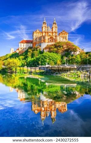 Melk Abbey, Austria. Stift Melk reflected in the water of Danube River, scenic Wachau Valley autumn sunny day.