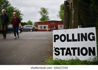 Melksham, UK - June 8, 2017: Voters leave a polling station at a village hall. Polling stations have opened across the nation as voters decide UK's government in a general election.