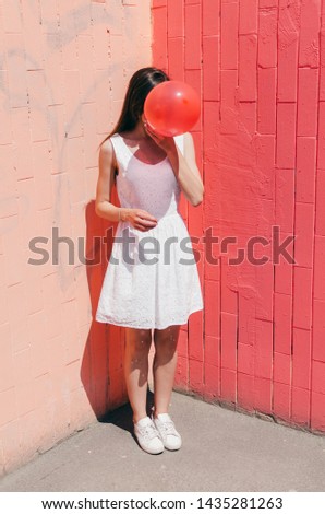 Similar – Junges Teenagermädchen, das rosa Kaugummi bläst.