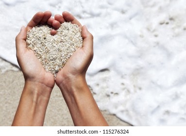 Mellow Heart Shaping Female Hands Above Beach