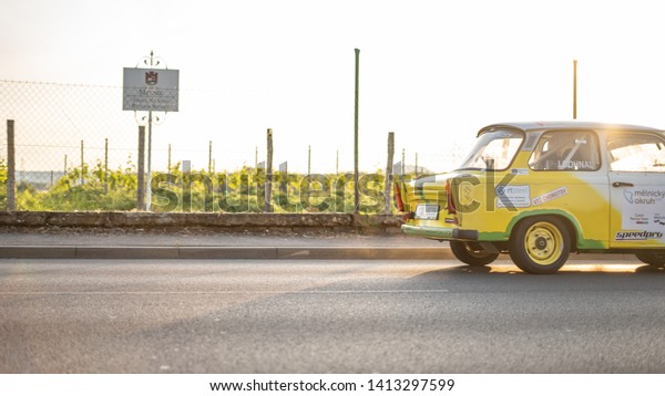 \
MELNIK, CZECH REPUBLIC - JUNE 1, 2019: Vehicle\
competing during the Rally Legend (historic race), Single yellow\
old car called Trabant or Trabbi, produced in the former GDR.\
Adapted for racing. 
