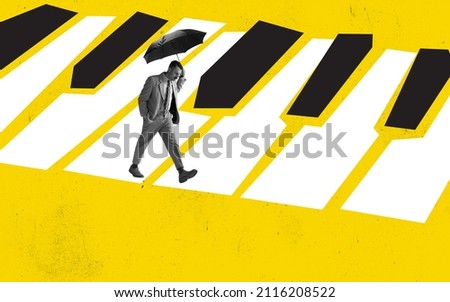 Melody of life. Contemporary art collage of serious man in a suit walking with umbrella along piano keys isolated on yellow background. Song and music writer. Concept of creativity, inspiration