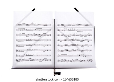 Melody Sheets On A Music Sheet Stand Isolated In White