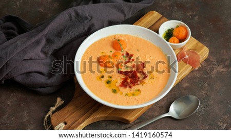 melon cold soup, with jamon, typical spanish                          