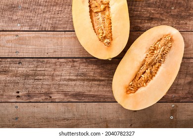 Melon. Pieces Of Fresh Melon For Making Fruit Dessert In Glass On An Old Wooden Background. Mock Up. Top View.